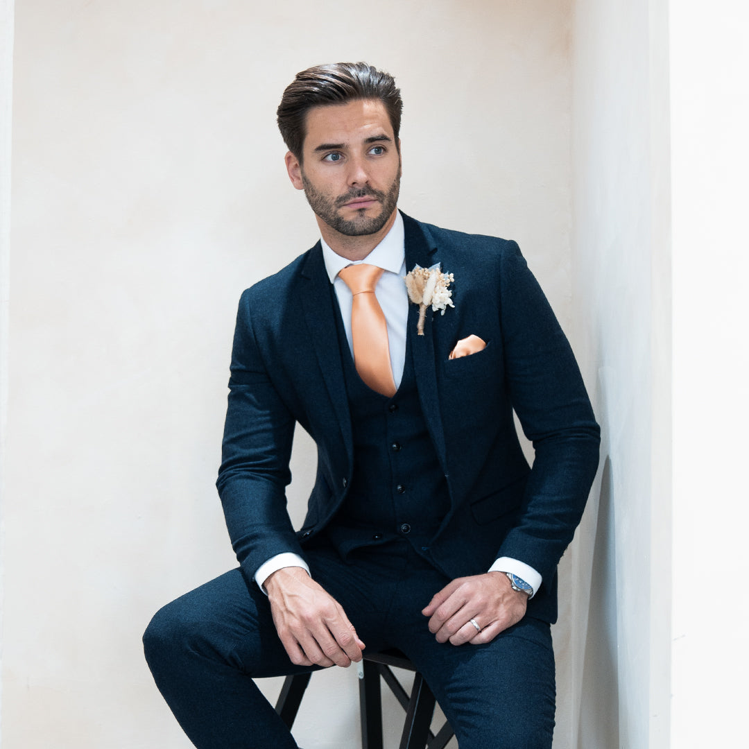 Master the art of suit accessories with Paul Andrew
