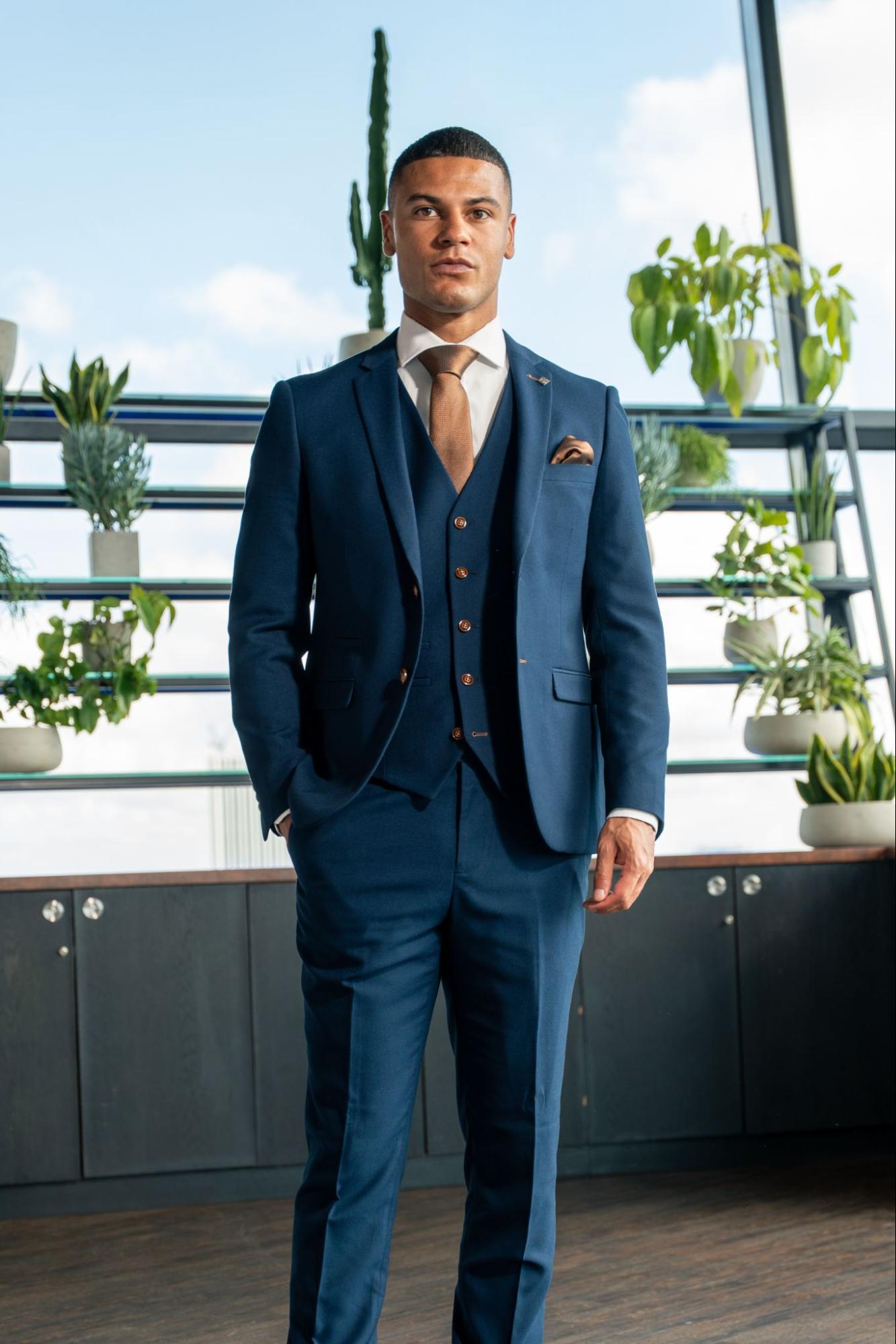 The Perfect Pairings: Matching Metals to Suit Fabrics