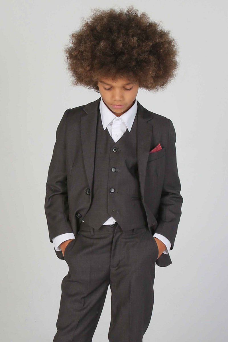 Device - Boy's Charles Charcoal Three Piece Suit - Dress your young gentleman in sophistication with this charcoal three-piece suit from Device, offering a blend of classic charm and contemporary style.